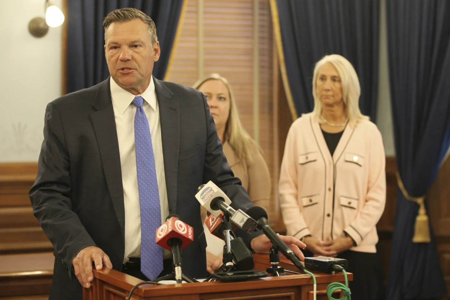 Kansas Attorney General Files Lawsuit to Bar Transgender License Changes, Challenging Governor's Stance