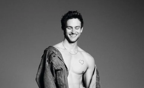 Watch: Brandon Flynn Unveils Sizzling Holiday Looks in Calvin Klein's 2023 Campaign